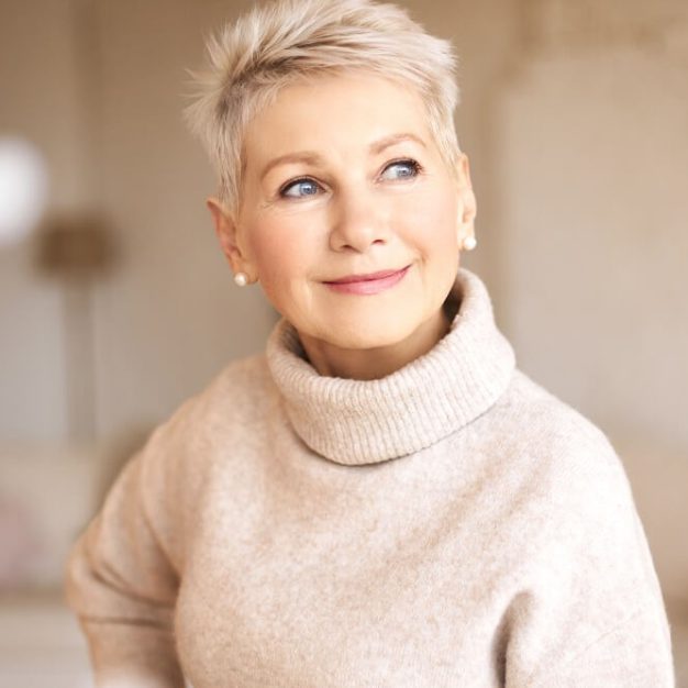 beautiful-happy-retired-woman-wearing-cozy-sweater-short-hairdo-1.jpg